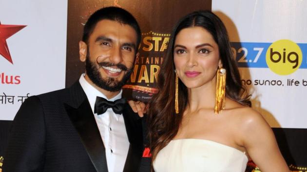 (FILES) Bollywood actors Ranveer Singh (L) and Deepika Padukone had their mehendi and sangeet functions on Tuesday.(AFP)