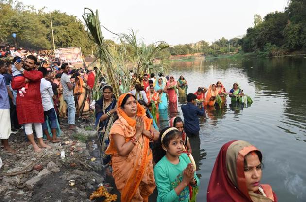 Chhath Puja is a festival dedicated to the Sun God, and his wife Usha. The festival is celebrated in Bihar, Uttar Pradesh, Jharkhand, Madhya Pradesh and Maharashtra. Internationally it is celebrated in Nepal and Mauritius. Women during the Chhath puja celebration at Chinchwad ghat on Tuesday. (HT PHOTO) 