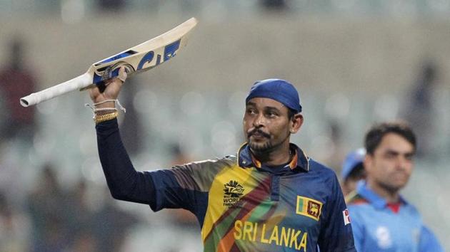 File image - Tillakaratne Dilshan raises his bat after helping his team win a match.(AP)