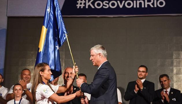 Kosovo's President Hashim Thaci (R) hands over the national flag to the Kosovar judoka Majlinda Kelmendi (L) during an official ceremony in Pristina on July 29, 2016 (AFP/Getty Images) Kosovo's President Hashim Thaci (R) hands over the national flag to the Kosovar judoka Majlinda Kelmendi (L) during an official ceremony in Pristina on July 29, 2016 (AFP/Getty Images)
