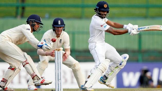 Sri Lanka's Roshen Silva (R) plays a shot next to England's wicketkeeper Ben Foakes.(REUTERS)