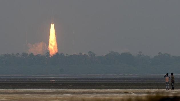 People look on as ISRO’s communication satellite GSAT-29, on board the eosynchronous Satellite Launch Vehicle (GSLV-mark III-D2), launches in Sriharikota.(AFP Photo)