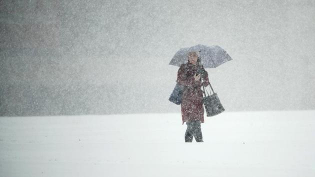 A woman walks across Independence Mall during a snow storm in Philadelphia on November 15, 2018. (Matt Rourke / AP) A woman walks across Independence Mall during a snow storm in Philadelphia on November 15, 2018. (Matt Rourke / AP)