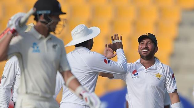 Pakistani spinner Yasir Shah (R) celebrates with teammate after taking the wicket of New Zealand batsman Ajaz Patel during the first Test match between Pakistan and New Zealand. (AFP) Pakistani spinner Yasir Shah (R) celebrates with teammate after taking the wicket of New Zealand batsman Ajaz Patel during the first Test match between Pakistan and New Zealand. (AFP)