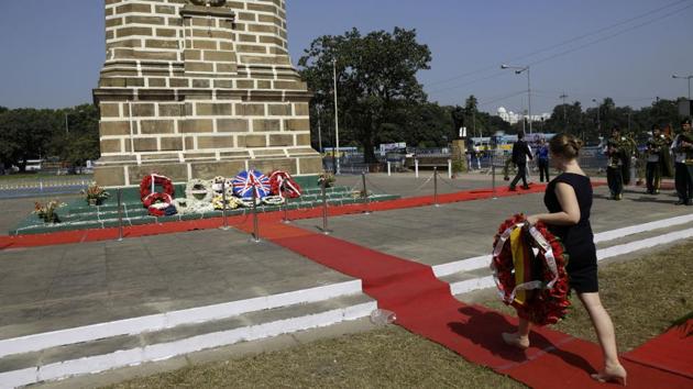 The German embassy Consular Attache Lisa Lorenz walks to place a wreath at the base of the cenotaph in memory of the fallen soldiers on Armistice Day in Kolkata. Armistice Day is the anniversary of the official end of World War I on Nov. 11, 1918, when a treaty was signed between Allies and Germany. Each year it falls on the Eleventh hour of the Eleventh Day of the Eleventh month of the year. (Bikas Das / AP) The German embassy Consular Attache Lisa Lorenz walks to place a wreath at the base of the cenotaph in memory of the fallen soldiers on Armistice Day in Kolkata. Armistice Day is the anniversary of the official end of World War I on Nov. 11, 1918, when a treaty was signed between Allies and Germany. Each year it falls on the Eleventh hour of the Eleventh Day of the Eleventh month of the year. (Bikas Das / AP)