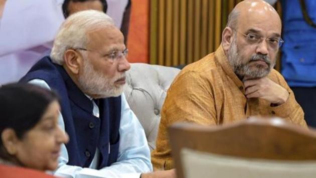 Prime Minister Narendra Modi, BJP President Amit Shah and External Affairs Minister Sushma Swaraj during a party meeting for the Assembly polls in Telangana, in New Delhi. The party released its 3rd list of candidates for the state on November 15.(AP File)