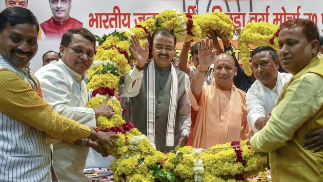 Uttar Pradesh Deputy chief minister Keshav Prasad Maurya(3L), surrendered before a Prayagraj court in two cases, violation of model code of conduct and a ten-year old case linked to a dispute of Durga Puja Pandal committee. His lawyers immediately filed a bail application which will be heard shortly. (Nand Kumar / PTI File) Uttar Pradesh Deputy chief minister Keshav Prasad Maurya(3L), surrendered before a Prayagraj court in two cases, violation of model code of conduct and a ten-year old case linked to a dispute of Durga Puja Pandal committee. His lawyers immediately filed a bail application which will be heard shortly. (Nand Kumar / PTI File)