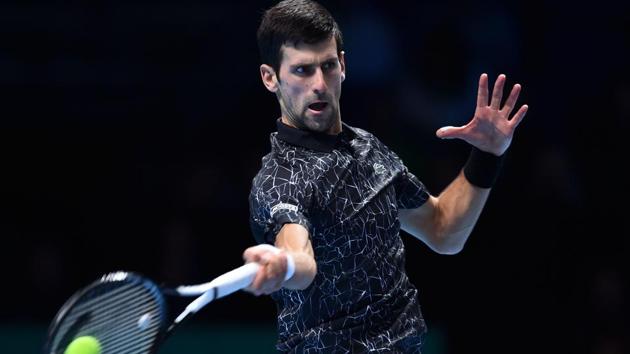 Serbia's Novak Djokovic returns against Germany's Alexander Zverev during their men’s singles round-robin match.(AFP)