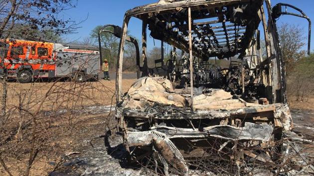 A fire engine is parked near to a burnt out bus after a bus accident in Gwanda about 550 kilometres south of the capital Harare. Police in Zimbabwe say more than 40 people have been killed in a bus accident.(AP) A fire engine is parked near to a burnt out bus after a bus accident in Gwanda about 550 kilometres south of the capital Harare. Police in Zimbabwe say more than 40 people have been killed in a bus accident.(AP)