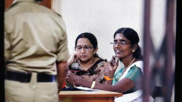 Hindu Aikya Vedi state president, K P Sasikala (in white sari) was detained early on Saturday morning from the premises of Sabarimala temple for defying prohibitory orders.(Vivek Nair/HT Photo)