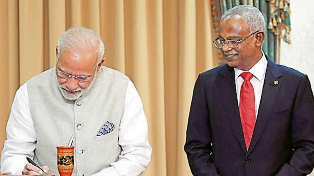 PM Modi signs a guestbook during Maldives President Ibrahim Solih’s presidential inauguration in Male, Maldives, Saturday. (AFP) PM Modi signs a guestbook during Maldives President Ibrahim Solih’s presidential inauguration in Male, Maldives, Saturday. (AFP)