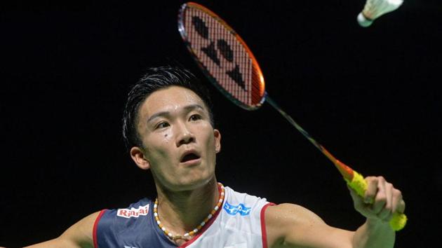 Kento Momota of Japan hits a return against Taiwan's Chou Tien-chen.(AFP)