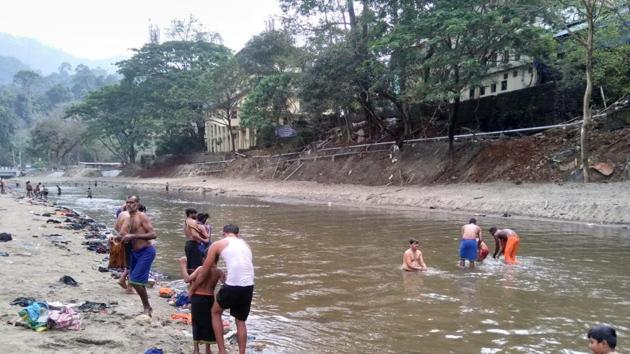 Sabarimala pilgrims bathe in the Pambha river ahead the trek to the hilltop shrine (HT Photo/Vivek Nair) (HT Photo) Sabarimala pilgrims bathe in the Pambha river ahead the trek to the hilltop shrine (HT Photo/Vivek Nair) (HT Photo)