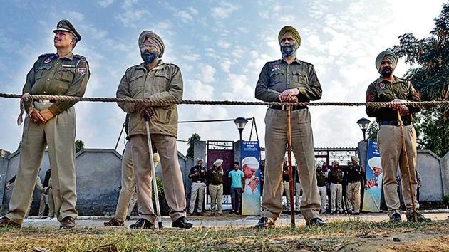 Police guard the venue of the prayer meet, situated in Amritsar’s Rajasansi area, on Sunday.(Reuters)