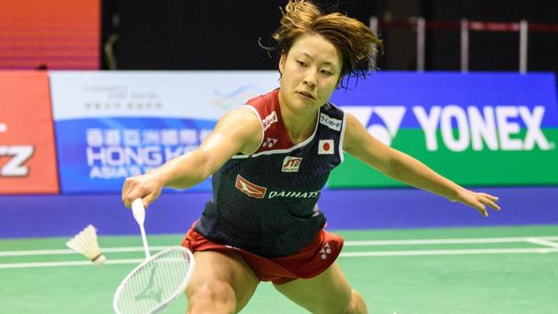 Japan's Nozomi Okuhara hits a return against Thailand's Ratchanok Intanon during their women's singles final.(AFP)