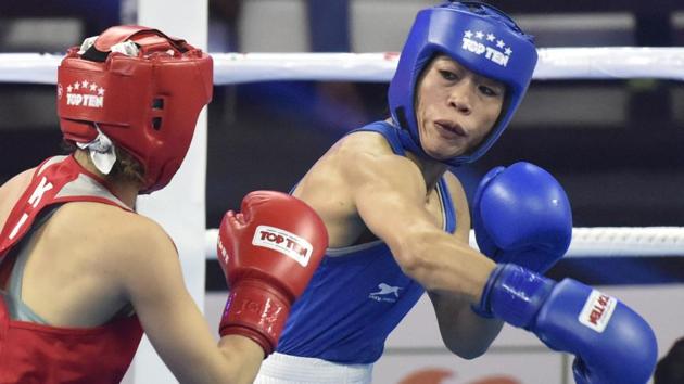 Mary Kom (in Blue) in a bout against Kazakhstan's Aigerim Kassenayeva (in Red), in Women's 45-48 kg category.(Sanjeev Verma/HT PHOTO)