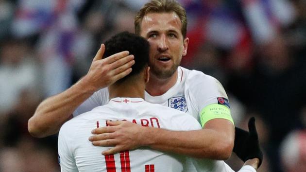 England's striker Harry Kane (R) and England's midfielder Jesse Lingard celebrate on the pitch.(AFP)