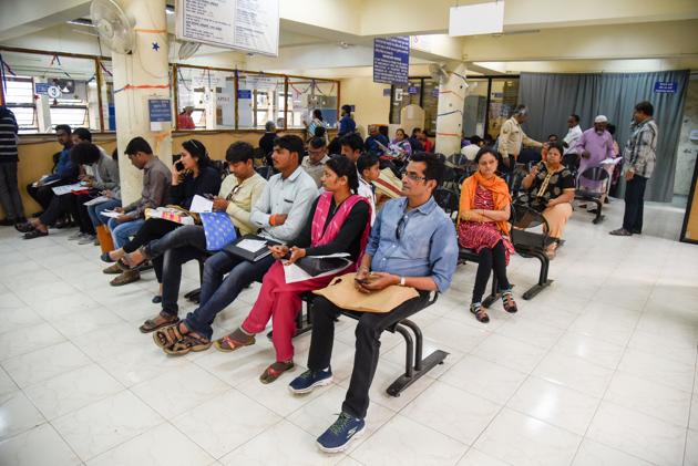 The Pune region of the passport office serves a total of 12 districts from western Maharashtra and Marathwada. Here, people are seen waiting in the regional passport office on SB road in Pune.(HT PHOTO)