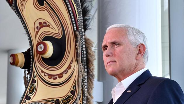 US vice president Mike Pence speaks to the media while standing next to a traditional mask display, at the end of meetings at the Asia-Pacific Economic Cooperation (APEC) Summit in Port Moresby on November 18, 2018. (AFP) US vice president Mike Pence speaks to the media while standing next to a traditional mask display, at the end of meetings at the Asia-Pacific Economic Cooperation (APEC) Summit in Port Moresby on November 18, 2018. (AFP)
