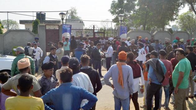 Police personnel and people seen outside the Nirankari Bhawan after two men on a motorcycle reportedly threw a grenade at the Nirankari Bhawan during a religious congregation, at Adliwal village, near Rajasansi, Amritsar, India, on Sunday, November 18, 2018.(Sameer Sehgal /Hindustan Times)