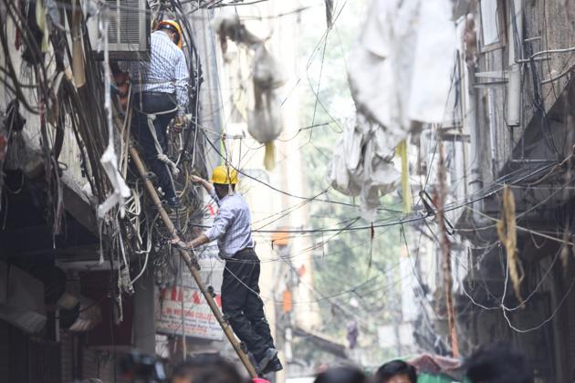 The firefighters on Monday said that four people were killed in a fire incident at a factory in Delhi’s Karol Bagh after one of them, a heavy built man, got stuck at the exit door while escaping the building and blocked the route for others. Delhi Fire Service (DFS) officials said the fire started at 12.23 pm after a solvent used for laundering clothes spilled out on the floor accidentally. (Amal KS / HT Photo) The firefighters on Monday said that four people were killed in a fire incident at a factory in Delhi’s Karol Bagh after one of them, a heavy built man, got stuck at the exit door while escaping the building and blocked the route for others. Delhi Fire Service (DFS) officials said the fire started at 12.23 pm after a solvent used for laundering clothes spilled out on the floor accidentally. (Amal KS / HT Photo)