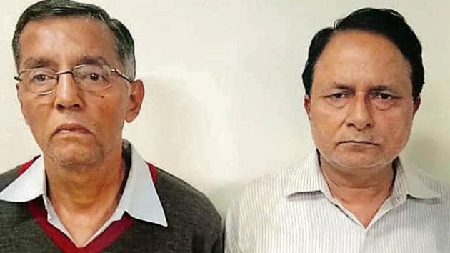 Former Centre for Cultural Resources and Training director GC Joshi (left) and former deputy director (finance) Anil Kohli (in white shirt) after their arrest on Saturday. (HT Photo) Former Centre for Cultural Resources and Training director GC Joshi (left) and former deputy director (finance) Anil Kohli (in white shirt) after their arrest on Saturday. (HT Photo)