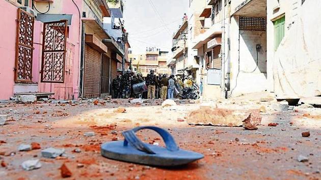 Police personnel inspect the area after two groups pelted stones at each other at Jeen Mata Ka Khurra in Ramganj area of Jaipur on Sunday, November 18, 2018. (HT Photo) Police personnel inspect the area after two groups pelted stones at each other at Jeen Mata Ka Khurra in Ramganj area of Jaipur on Sunday, November 18, 2018. (HT Photo)