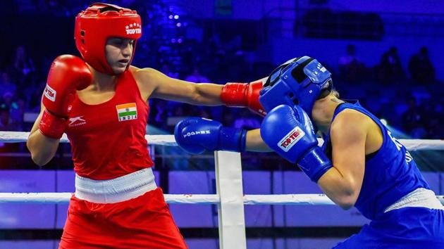 India’s Pinki Rani (in Red) in action against England's Ebonie Jones during Fly category (51 kg) bout at preliminaries phase of AIBA Women's World Boxing Championships, in New Delhi, Monday.(PTI)