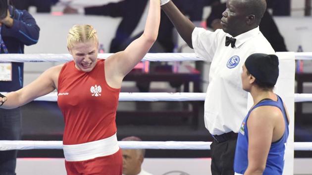 Poland`s Elzbieta Wojcik (in Red) reacts after her victory against Saweety Boora (in Blue) in Women's 75kg category during AIBA Women's World Boxing Championships 2018, at IG Stadium, in New Delhi, India.(Sanjeev Verma/HT PHOTO)