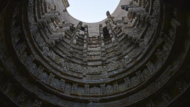 A view of intricately adorned wall of the stepwell. Vav was built by queen Udayamati, the wife of King Bhimdeva I of the Solanki dynasty, in the memory of her husband after his death. While popular history had always credited Udaymati for having built the Ranki vav photo, Ravindra Singh Bisht, a retired ASI joint director-general, said historical research too has established her link with the stepwell. (Sanchit Khanna / HT Photo)