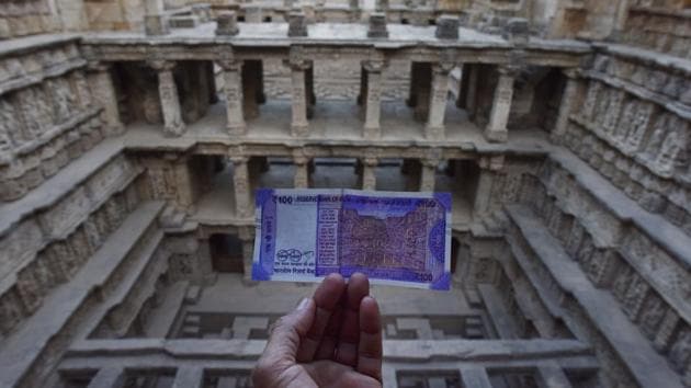 A photo of the new ₹100 note which has a motif of the 11th century stepwell on the reverse side. While the release of the new note was announced in July, it was only last month, in October, that it became easily available in the market The motif of the Vav on the note is a pale reflection of the majesty of the stepwell that had been lost for centuries beneath the sands of time. (Sanchit Khanna / HT Photo)