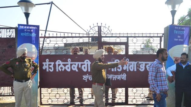 Police personnel and people seen outside the Nirankari Bhawan after a grenade attack during a religious congregation, at Adliwal village, near Rajasansi, Amritsar,on Sunday, November 18, 2018.(Sameer Sehgal / HT Photo) Police personnel and people seen outside the Nirankari Bhawan after a grenade attack during a religious congregation, at Adliwal village, near Rajasansi, Amritsar,on Sunday, November 18, 2018.(Sameer Sehgal / HT Photo)