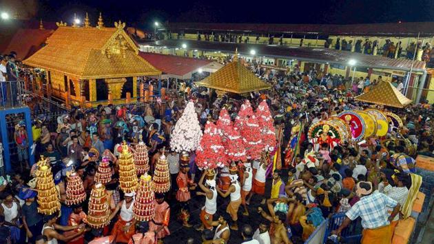 In this file photo dated December 24, 2014, a ‘Karppoorazhi’ procession is being taken out at Lord Ayyappa temple, in Sabarimala.(PTI)