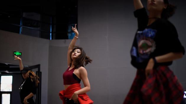 Ya moved to Beijing in May to pursue dance full-time, renouncing her 9-to-5 gig at a government bureau in Hebei province. Her parents were not pleased. “They didn’t agree, but I am willing to push back,” she said. “They are not paying for my living expenses, so doing what I want isn’t their burden.” (Wang Zhao / AFP)