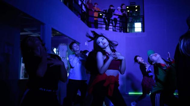 Young parents view the dance style as a cure for introversion while others see it as a form of exercise that embraces self-expression at the expense of tradition. “All parents want their daughters to be well behaved and find a stable job, then find a good husband, get married, and have kids,” said Ya Xin, a 25-year-old dancer. (Wang Zhao / AFP)