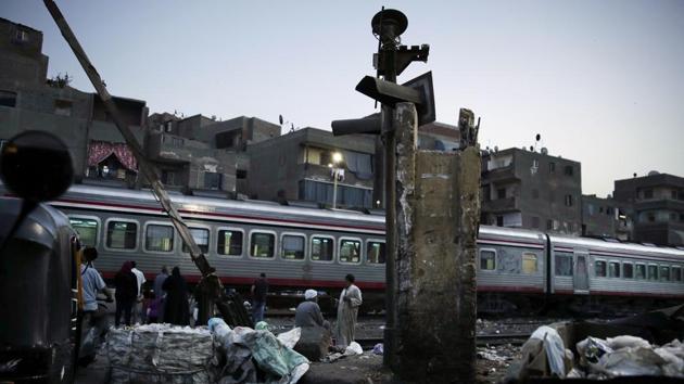 “There is something very wrong with the order of priorities,” said political analyst Hassan Nafaa. “Maybe el-Sissi wants to go down in history as the leader who built the new capital, but if Egyptians don’t see an improvement in their living conditions and services, he will be remembered as the president who destroyed what is left of the middle class.” (Nariman El-Mofty / AP) “There is something very wrong with the order of priorities,” said political analyst Hassan Nafaa. “Maybe el-Sissi wants to go down in history as the leader who built the new capital, but if Egyptians don’t see an improvement in their living conditions and services, he will be remembered as the president who destroyed what is left of the middle class.” (Nariman El-Mofty / AP)