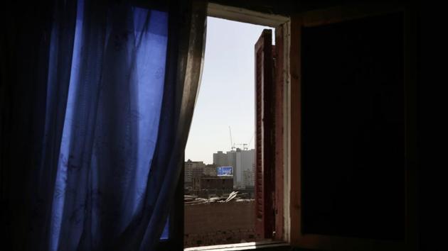 A window in a Cairo slum shows a billboard advertising a gated suburban compound. The government is renovating some of Cairo’s illegally built neighbourhoods. But in one case, it razed a run-down district and moved out residents after compensating them to make way for a high-end district. Amar Ali Hassan, a sociopolitical expert, believes Cairo could be left to die a slow death. (Nariman El-Mofty / AP) A window in a Cairo slum shows a billboard advertising a gated suburban compound. The government is renovating some of Cairo’s illegally built neighbourhoods. But in one case, it razed a run-down district and moved out residents after compensating them to make way for a high-end district. Amar Ali Hassan, a sociopolitical expert, believes Cairo could be left to die a slow death. (Nariman El-Mofty / AP)