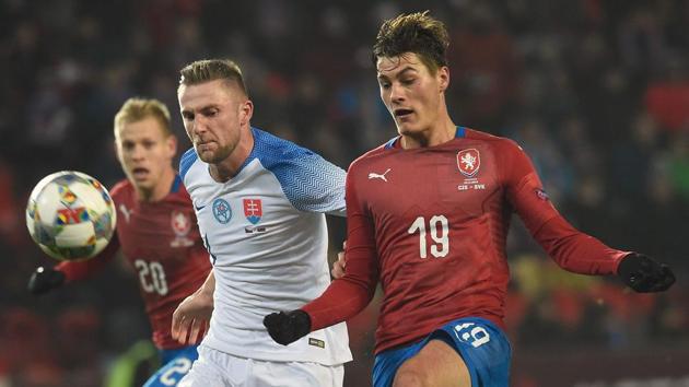 Czech Republic's forward Patrik Schick scores next to Slovakia's defender Milan Skiniar during their UEFA Nations League game.(AFP)