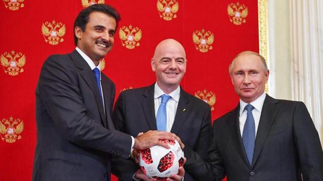 (From left) Emir of Qatar Sheikh Tamim bin Hamad Al-Thani, FIFA president Gianni Infantino and Russian president Vladimir Putin pose for a photography during a symbolic transfer of the authority to Qatar to host the World Cup 2022. (AFP) (From left) Emir of Qatar Sheikh Tamim bin Hamad Al-Thani, FIFA president Gianni Infantino and Russian president Vladimir Putin pose for a photography during a symbolic transfer of the authority to Qatar to host the World Cup 2022. (AFP)