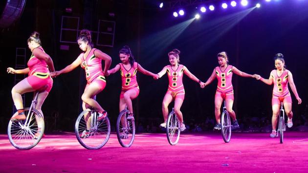 Artists of Rambo circus perform stunts in Mundhwa on Saturday. Rambo circus big-top (tent) is the ‘biggest movable tent’ with a diameter of 235 feet which is custom made. (SANKET WANKHADE/HT PHOTO) Artists of Rambo circus perform stunts in Mundhwa on Saturday. Rambo circus big-top (tent) is the ‘biggest movable tent’ with a diameter of 235 feet which is custom made. (SANKET WANKHADE/HT PHOTO)