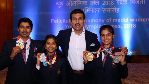 Minister of State for Youth Affairs & Sports, Rajyavardhan Singh Rathore with shooters Saurabh Chaudhury, Mehuli Ghosh, and Manu Bhaker during the winners of the Summer Youth Olympics 2018 felicitation ceremony, in New Delhi(PTI)