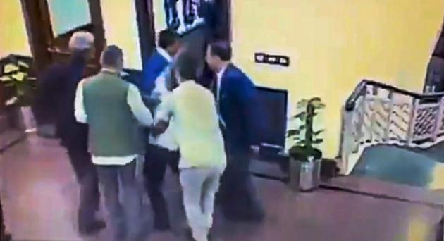 A still from a video posted by the AAP on its twitter account shows Anil Kumar being held after he allegedly threw chilli powder at Delhi Chief Minister Arvind Kejriwal, outside his chamber at Delhi Secretariat in New Delhi on November 20. (PTI Photo) A still from a video posted by the AAP on its twitter account shows Anil Kumar being held after he allegedly threw chilli powder at Delhi Chief Minister Arvind Kejriwal, outside his chamber at Delhi Secretariat in New Delhi on November 20. (PTI Photo)