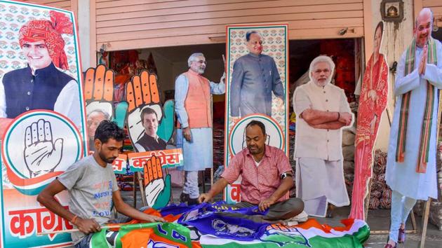 Workers prepare promotional material for BJP and Congress ahead of the Rajasthan Assembly Elections, at Tripolia Bazaar in Jaipur, Wednesday, Nov. 14, 2018. (PTI) Workers prepare promotional material for BJP and Congress ahead of the Rajasthan Assembly Elections, at Tripolia Bazaar in Jaipur, Wednesday, Nov. 14, 2018. (PTI)