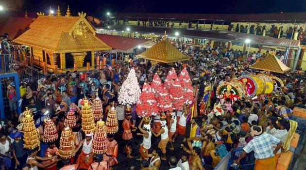 In this file photo dated Dec 24, 2014, a ‘Karppoorazhi’ procession is being taken out at Lord Ayyappa temple, in Sabarimala.(PTI) In this file photo dated Dec 24, 2014, a ‘Karppoorazhi’ procession is being taken out at Lord Ayyappa temple, in Sabarimala.(PTI)