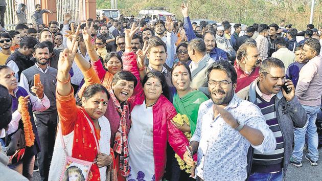 People celebrate outside the counting centre in Dehradun on Tuesday as results for 84 ULBs and 1,064 wards began to trickle in.(HT Photo)