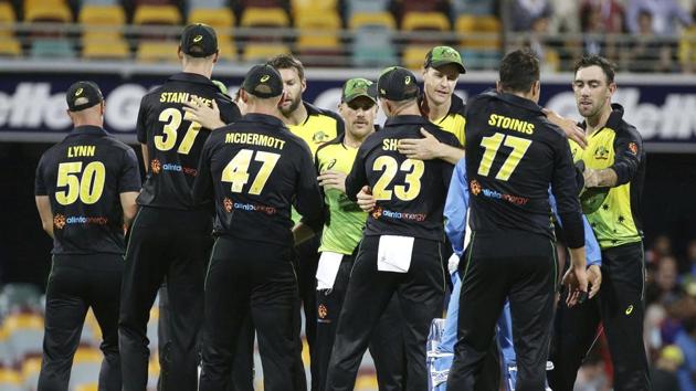 Australia players celebrate after winning the first T20 International cricket match between Australia and India in Brisbane, Australia, Wednesday, Nov. 21, 2018. (AP Photo/Tertius Pickard)(AP)