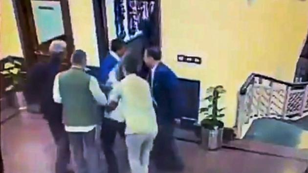 A still from a video posted by the AAP on its twitter account shows Anil Kumar being held after he allegedly threw chilli powder at Delhi chief minister Arvind Kejriwal, outside his chamber at Delhi Secretariat in New Delhi on November 20.(PTI Photo) A still from a video posted by the AAP on its twitter account shows Anil Kumar being held after he allegedly threw chilli powder at Delhi chief minister Arvind Kejriwal, outside his chamber at Delhi Secretariat in New Delhi on November 20.(PTI Photo)