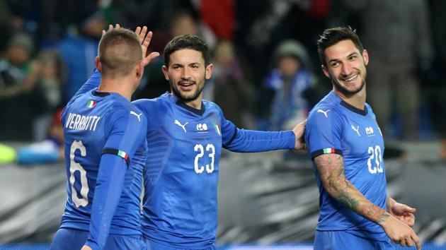 Italy's Matteo Politano celebrates scoring their first goal with Marco Verratti and Stefano Sensi.(REUTERS)