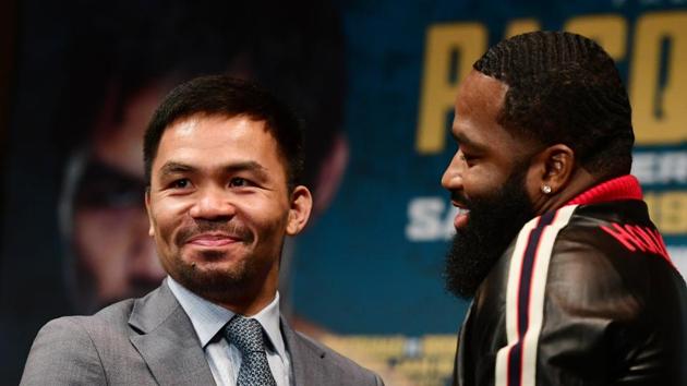 Manny Pacquiao (left) will face Adrien Broner in January.(AFP)