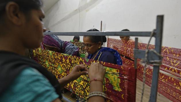 But over the years, in Patan, the number of traditional Patol weaver families has dwindled from 700 to just two or three. Bharat Kantilal Salvi, Rohit’s younger brother explained that there was a huge demand of Patola abroad and traders used to come via the Multan route but during the second world war, trade was disrupted, starting the downfall of the weavers. (Sanchit Khanna / HT Photo)